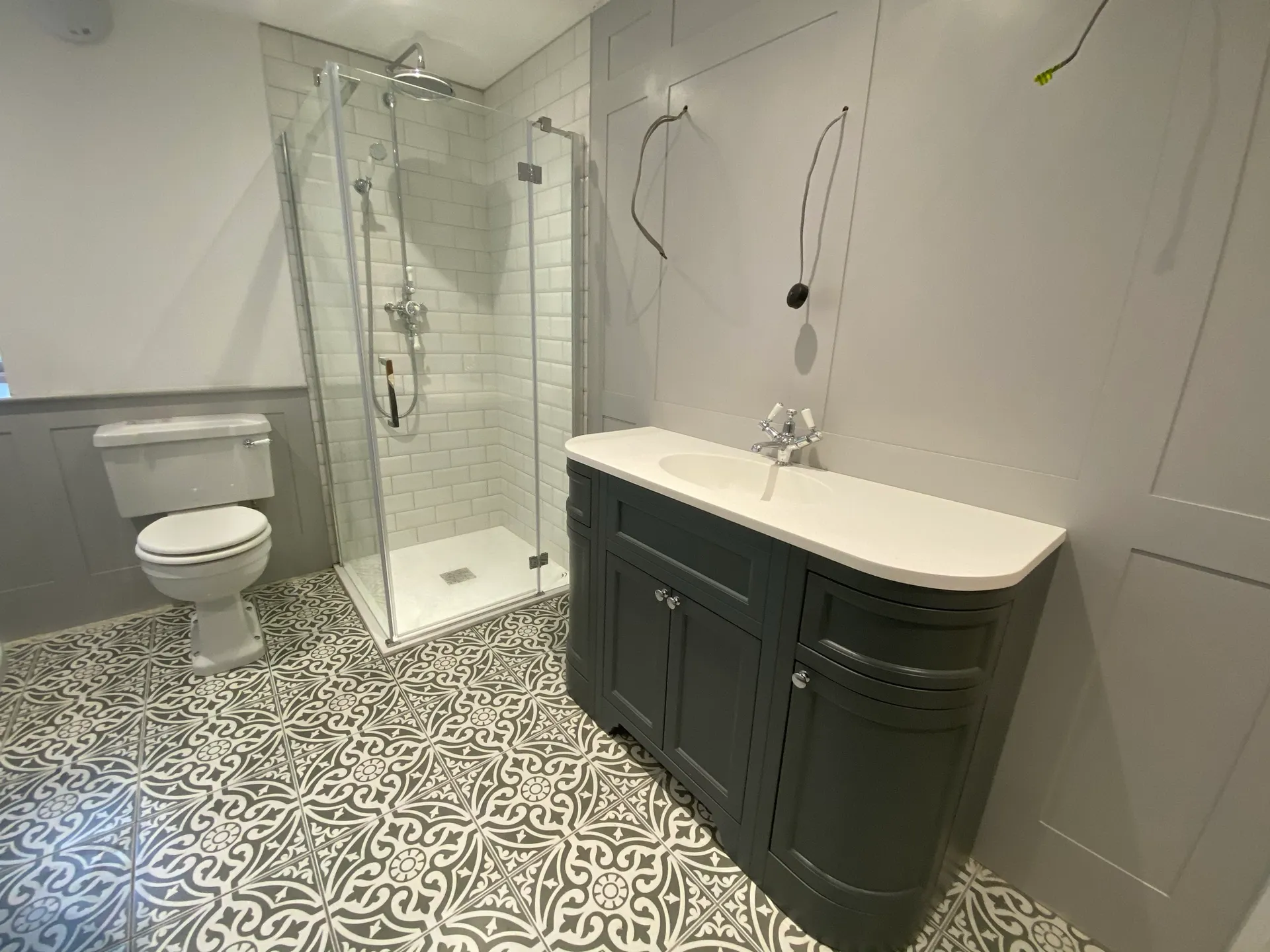 Roll-top clawfoot bathroom - shaker vanity corner shower